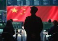 Communist China military personnel in a high tech government hacking room work on stealing state secrets from rival countries in hybrid war. Chinese communist criminals and army exploit advanced technology, inflict fear. Camera B.