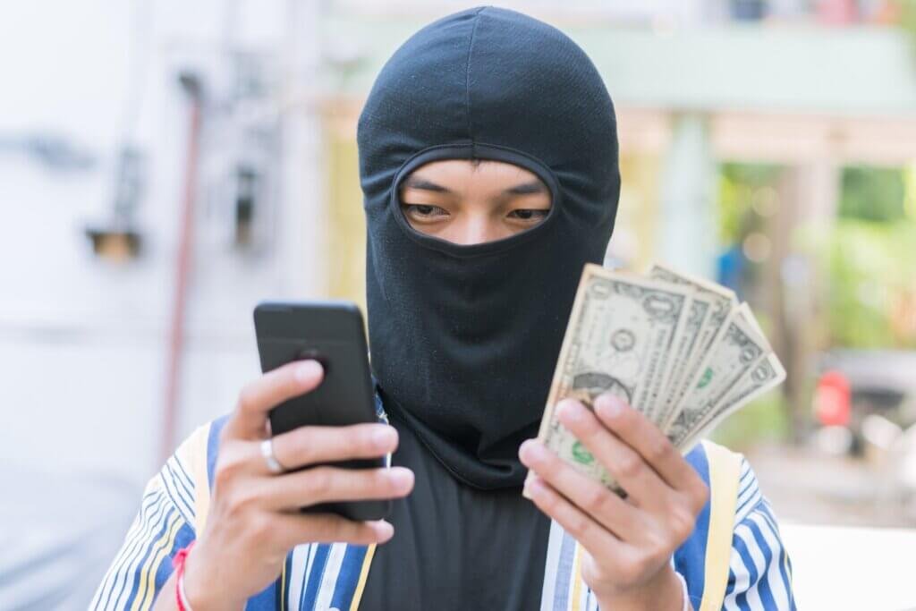 man-close-up-thief-in-a-mask-and-colorful-shirt-on